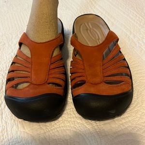 Orange Keens slip on